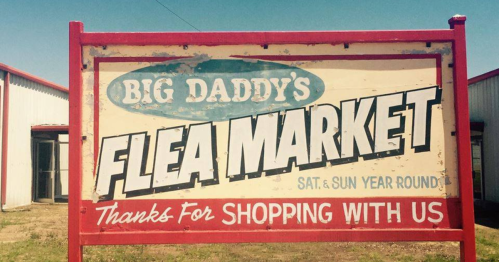 Sign for "Big Daddy's Flea Market," open Saturday and Sunday year-round, thanking customers for shopping.