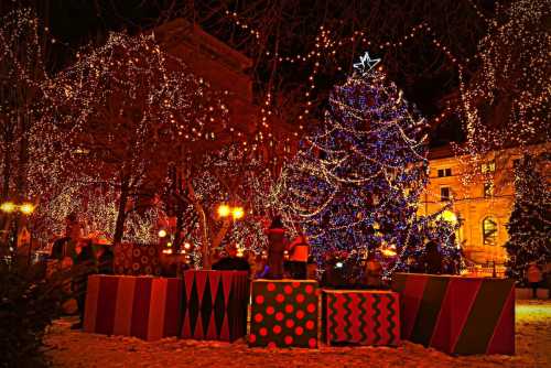 A festive scene featuring a brightly lit Christmas tree surrounded by colorful gift boxes and twinkling lights.