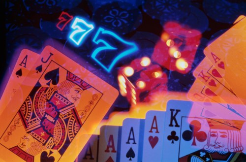 Colorful playing cards and dice with glowing numbers, creating a vibrant casino atmosphere.