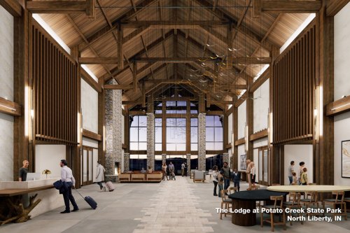Interior view of The Lodge at Potato Creek State Park, featuring a spacious, modern design with wooden beams and large windows.