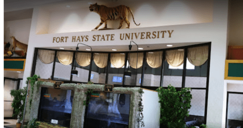 Interior view of Fort Hays State University entrance, featuring a tiger display and decorative plants.