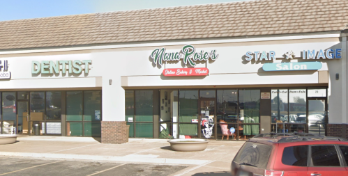 A storefront featuring a dentist, Nana Rose's Italian Eatery, and Star Image Salon in a shopping plaza.