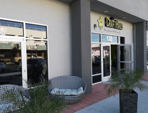 Exterior of CraftHaus Brewery with modern seating and a welcoming entrance.