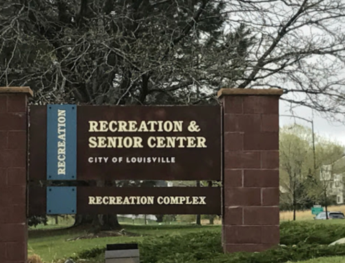 Sign for the Recreation and Senior Center in the City of Louisville, featuring a recreation complex.