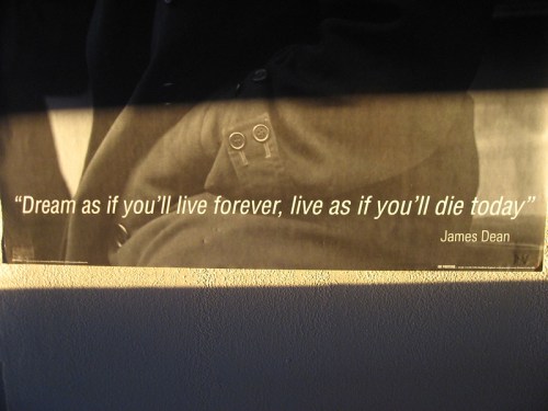 A poster featuring a quote by James Dean: "Dream as if you'll live forever, live as if you'll die today."