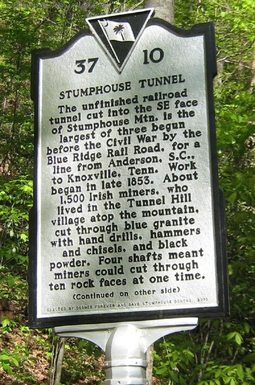 Historical marker for Stumphouse Tunnel, detailing its construction and significance in the 1850s.