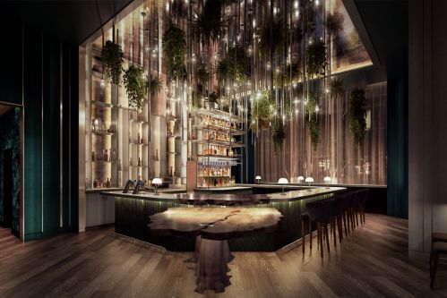 A modern bar with hanging lights and plants, featuring a unique wooden counter and stylish seating.