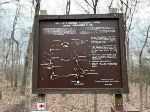 Sign for Pickle Springs Natural Area, detailing the "Trail Through Time" with a map and guidelines for visitors.