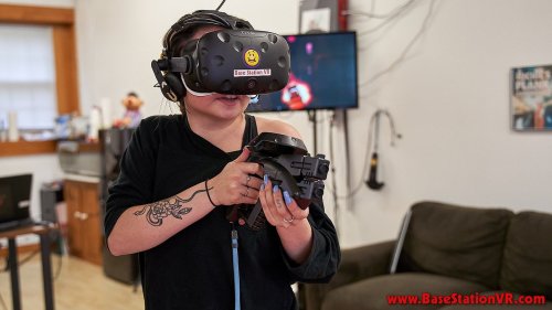 A person wearing a VR headset holds a controller, immersed in a virtual reality experience in a cozy room.