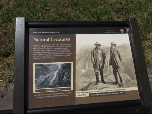 Sign at John Muir National Historic Site highlighting natural treasures and featuring a historic photo of Muir and Roosevelt.