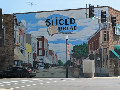 Mural depicting a street scene with the text "Home of Sliced Bread" in Chillicothe, Missouri.