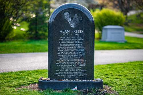 A gravestone for Alan Freed, detailing his contributions to rock and roll and his legacy in music history.