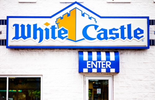 Sign for White Castle restaurant with a blue and yellow color scheme, featuring the word "ENTER" above the door.