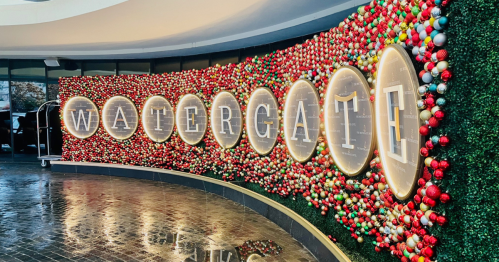 Colorful holiday display featuring the word "WATERGATE" surrounded by festive decorations.