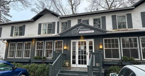 Exterior of Farina's Supper Club, a two-story building with white brick and green shutters, surrounded by trees.