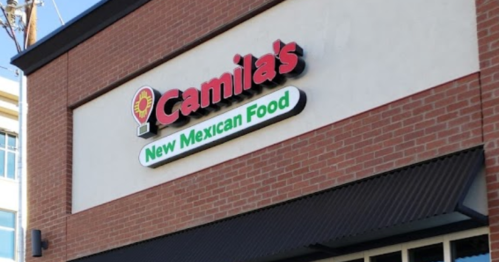 Sign for "Camila's New Mexican Food" on a brick building, featuring a colorful logo.