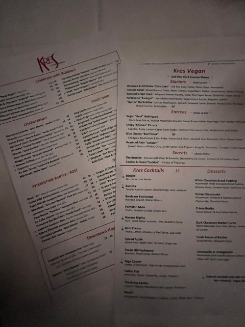 Menus from Kres, featuring sections for starters, entrees, desserts, and cocktails, with various food and drink options.