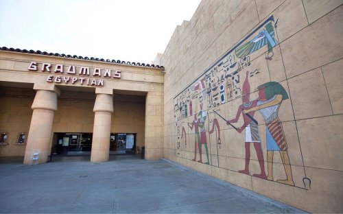 Exterior of Grauman's Egyptian Theatre featuring ancient Egyptian mural and entrance.