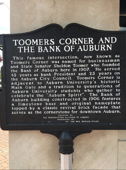 Historical marker about Toomers Corner and the Bank of Auburn, detailing its significance to the community and university.