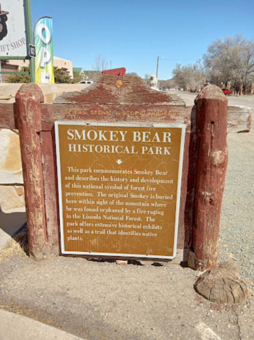 Sign for Smokey Bear Historical Park, detailing its history and the original Smokey Bear's burial site.