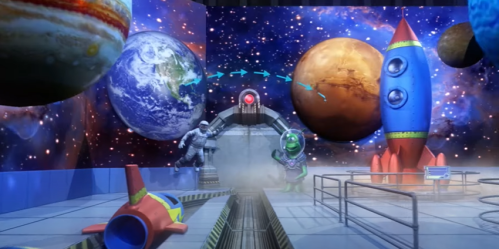A colorful space-themed scene with planets, rockets, and an astronaut alongside a cartoon alien character.