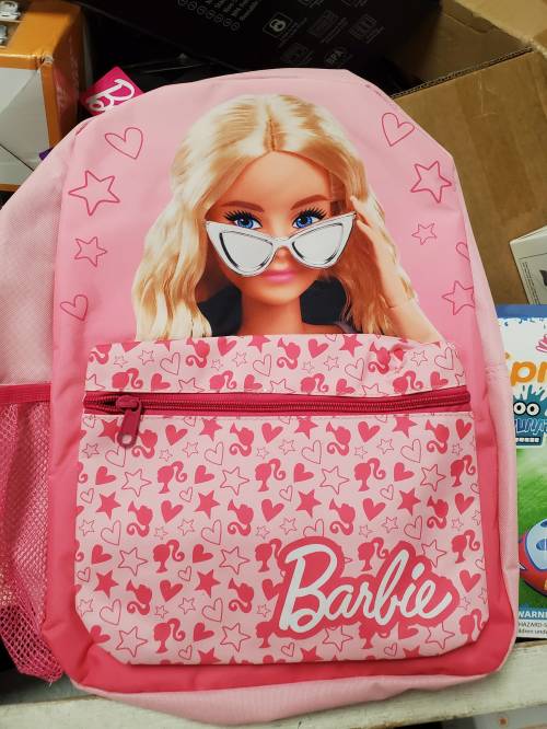 A pink backpack featuring a Barbie design with sunglasses and star patterns, along with a front zip pocket.