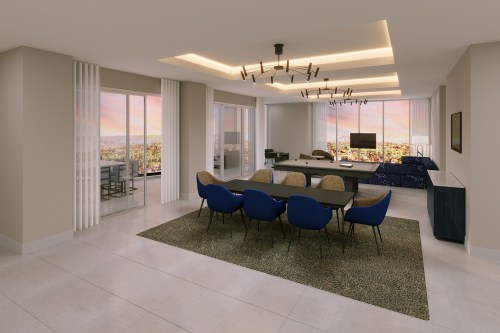 Modern living space featuring a dining area with blue chairs, a sleek table, and large windows showcasing a scenic view.