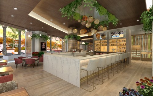 Modern restaurant interior featuring a bar, seating areas, and greenery decor, with warm lighting and a welcoming atmosphere.