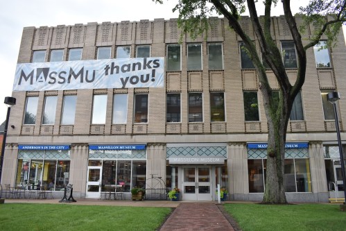 Exterior of the Massillon Museum with a large banner reading "MASSMu thanks you!" displayed on the building.
