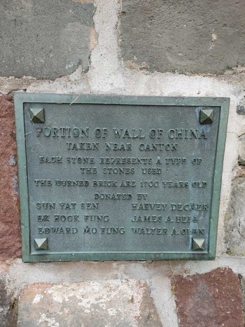 Plaque describing a portion of the Great Wall of China, detailing its history and donors.