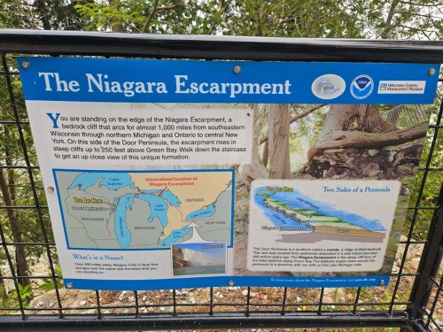 Sign about the Niagara Escarpment, featuring a map and information on its geological significance and location.