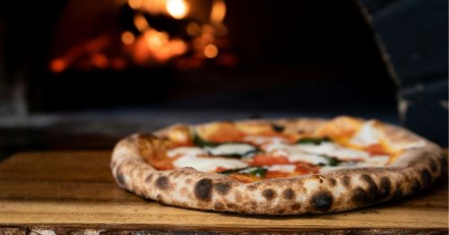 A close-up of wood-fired pizza