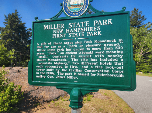 Sign for Miller State Park in New Hampshire, detailing its history and significance as the state's first state park.