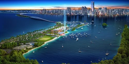 Aerial view of a vibrant waterfront city with skyscrapers, a marina, and lush greenery along the shoreline.