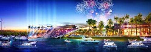 A vibrant waterfront scene with boats, a modern amphitheater, palm trees, and fireworks lighting up the evening sky.