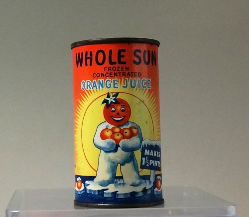 Vintage can of Whole Sun frozen concentrated orange juice, featuring a cheerful orange character holding oranges.