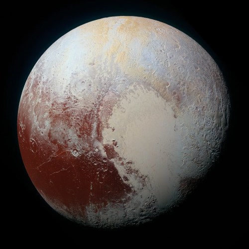 A detailed view of Pluto's surface, showcasing its icy plains and varied terrain in shades of red and white.