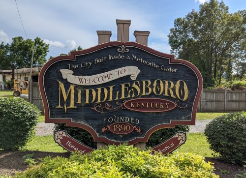 Welcome sign for Middlesboro, Kentucky, founded in 1890, highlighting its unique location inside a meteorite crater.