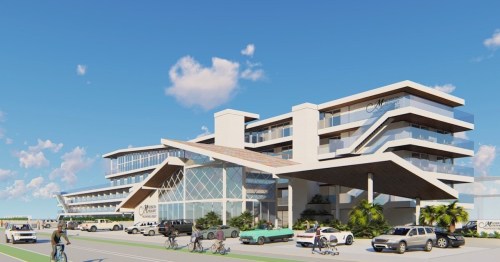 Modern multi-story building with a sleek design, surrounded by vehicles and people biking on a sunny day.