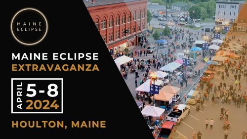 Crowd gathered at an outdoor event in Houlton, Maine, promoting the Maine Eclipse Extravaganza, April 5-8, 2024.