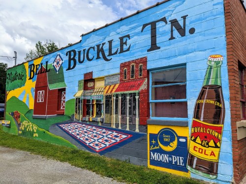Colorful mural depicting historic buildings and local products in Bell Buckle, TN, including a Moon Pie and Royal Crown Cola.