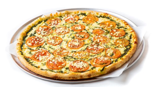 A freshly baked pizza topped with sliced tomatoes and crumbled cheese on a golden crust.