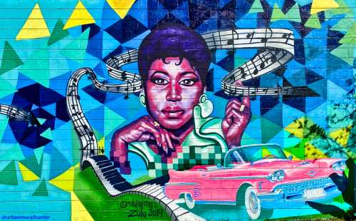 Colorful mural featuring a woman with musical notes and a pink vintage car, celebrating art and culture.