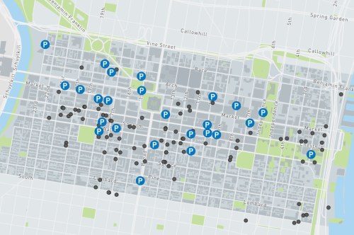 Map of a city showing parking locations marked with blue and black dots, indicating available and occupied spaces.