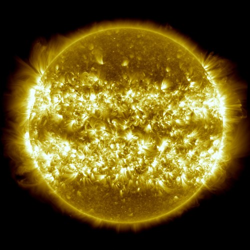 A vibrant, detailed image of the sun, showcasing bright solar flares and intricate surface textures against a black background.