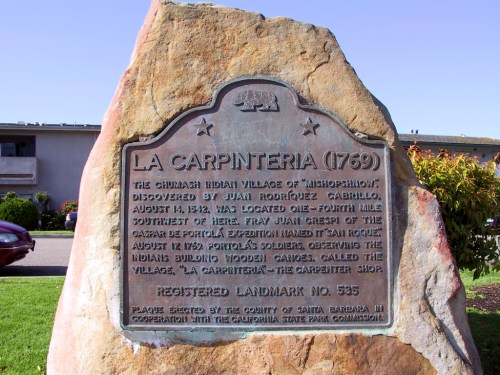 A historical plaque marking the site of La Carpinteria, established in 1769, detailing its significance and history.