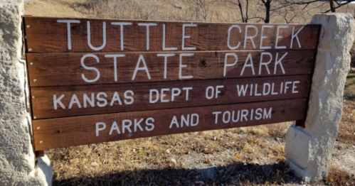 Wooden sign for Tuttle Creek State Park, Kansas Department of Wildlife, Parks and Tourism.