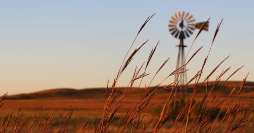 The sun begins to set over the Nebraska Sandhills.