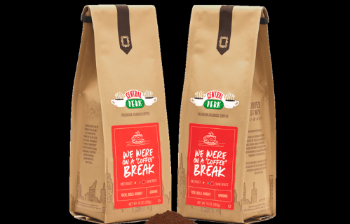 Two bags of premium Arabica coffee with a playful label reading "We Were on a Coffee Break." Ground coffee visible.