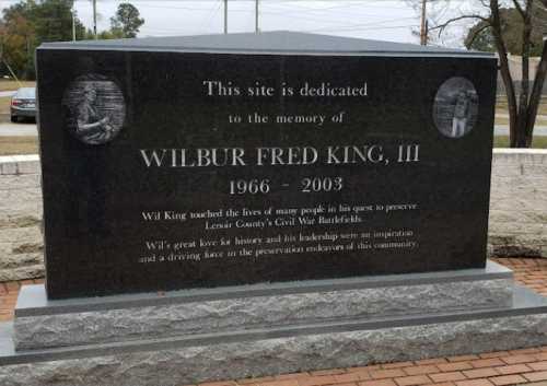 A memorial stone dedicated to Wilbur Fred King, III, honoring his efforts to preserve local Civil War battlefields.